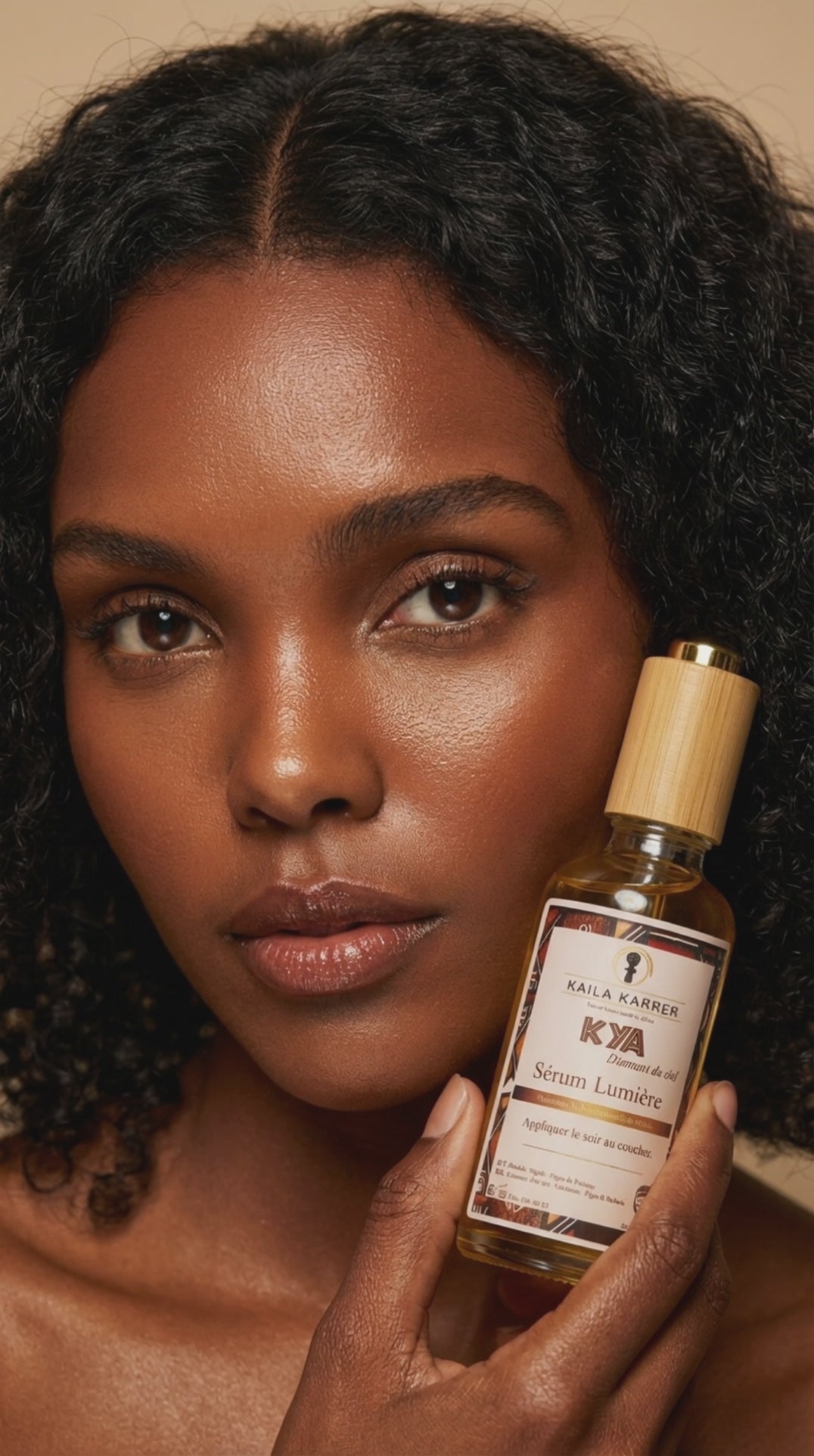 Load video: A black woman holding a face serum